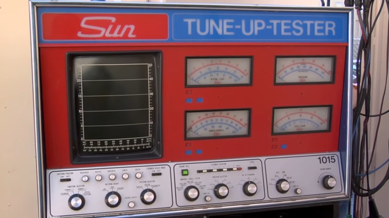 A red and blue Sun Tune-Up-Tester in good conditions.