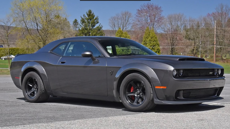 Grey 2019 Dodge Challenger SRT Demon parked on a road, trees in the background.