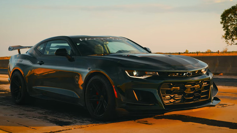2024 Hennessey Exorcist Camaro ZL1 on a road at sunset.