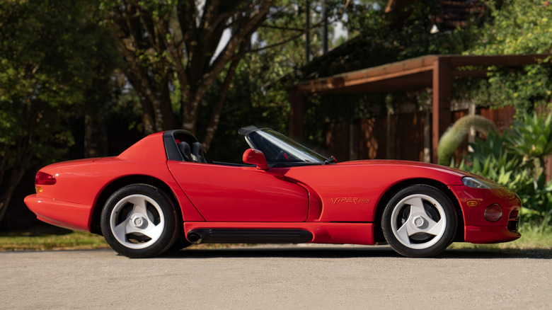 Side view of red Dodge Viper RT/10 parked in driveway.