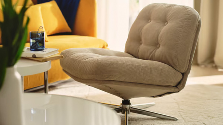 An Ikea swivel chair in beige in a living room