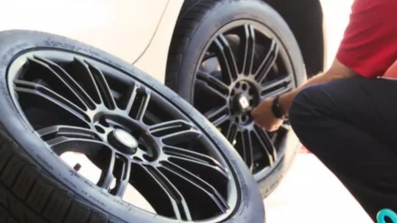 Person replacing tire