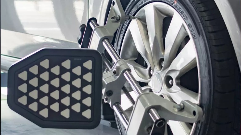 Tire with alignment tool clamped on