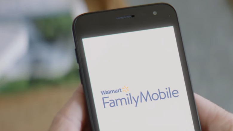 Phone displaying Walmart Family Mobile logo
