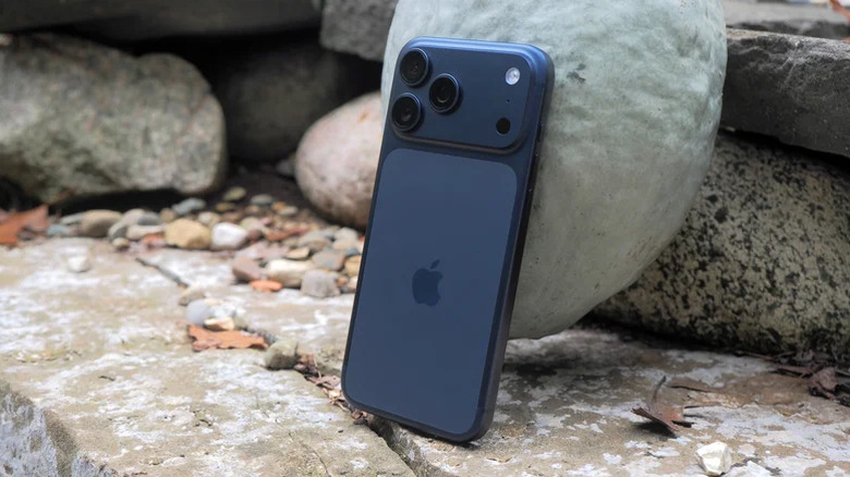 Blue iPhone 17 Pro Max resting on a rock