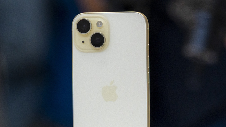 iPhone 15 in yellow color showcasing the dual-camera setup