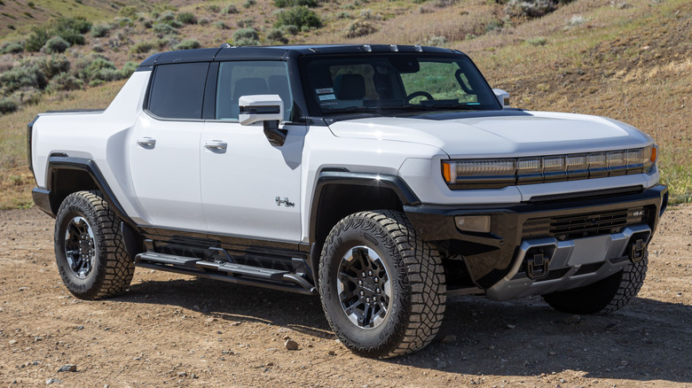 A Hummer EV 3X parked in a rural setting.