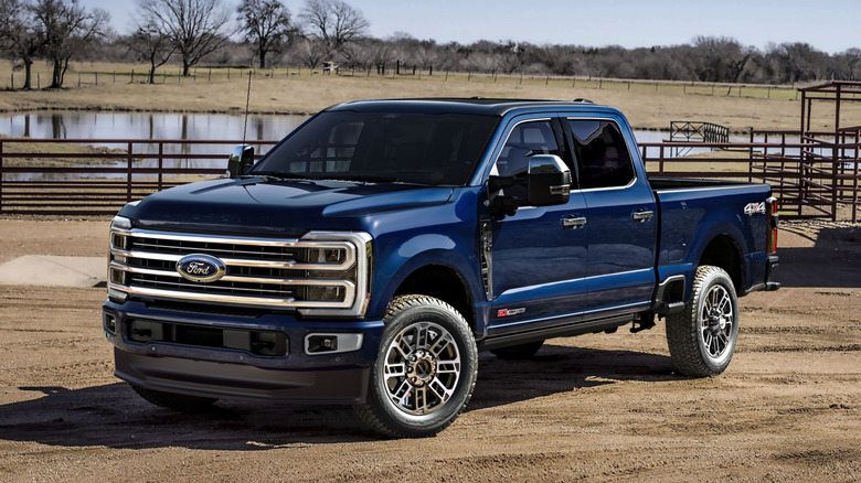 Blue Ford F-350 Super Duty parked at a ranch