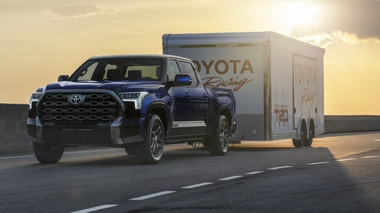 A blue Toyota Tundra towing a trailer
