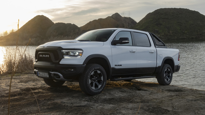 A white 2020 RAM 2500 truck parked near a lake.