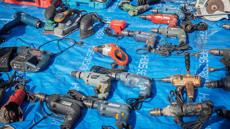several used tools on a blue background.