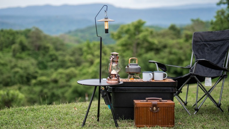 Table and chair are set up for a camping trip