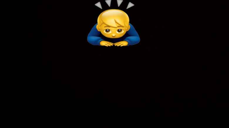 Person bending forward in a deep bow