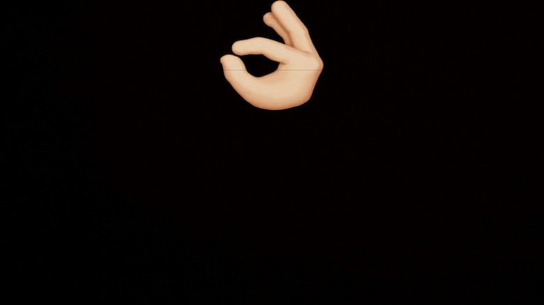 Hand making an OK sign