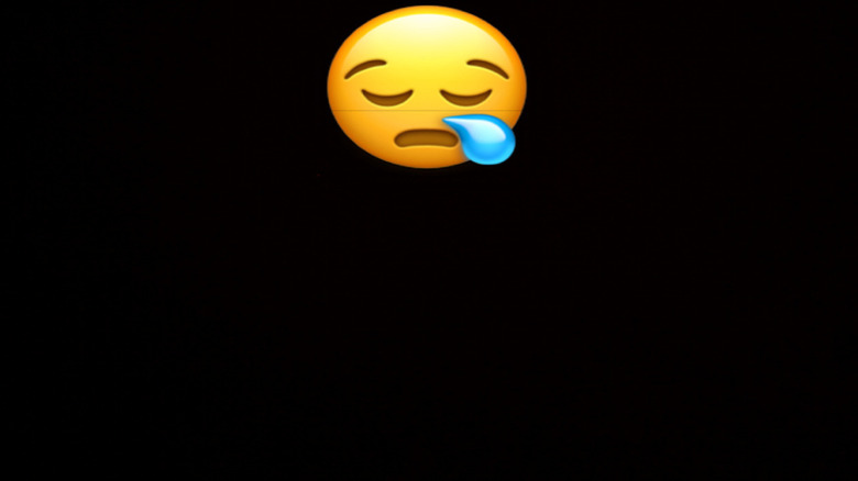 Face with closed eyes and a snot bubble
