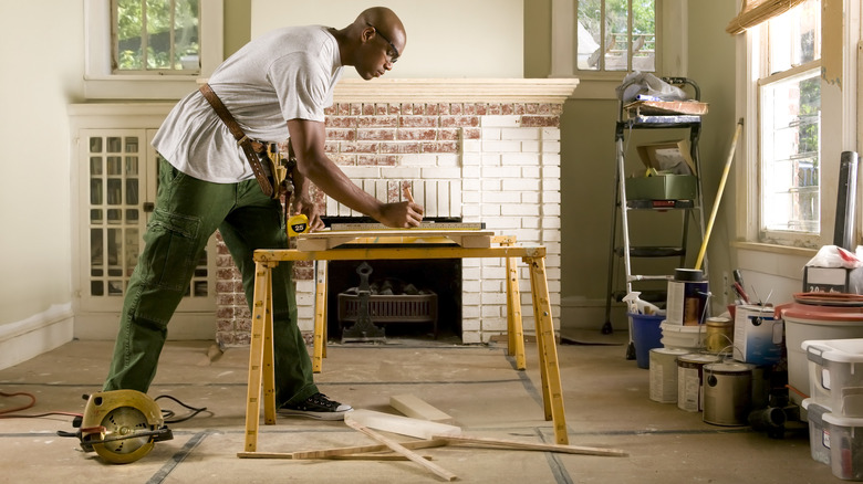 A man uses a workbench for a project