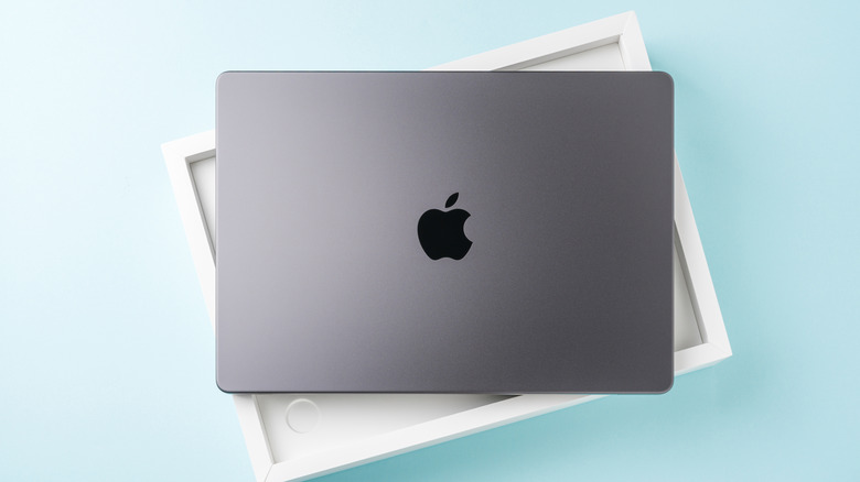 M5 MacBook Pro placed atop its packaging box