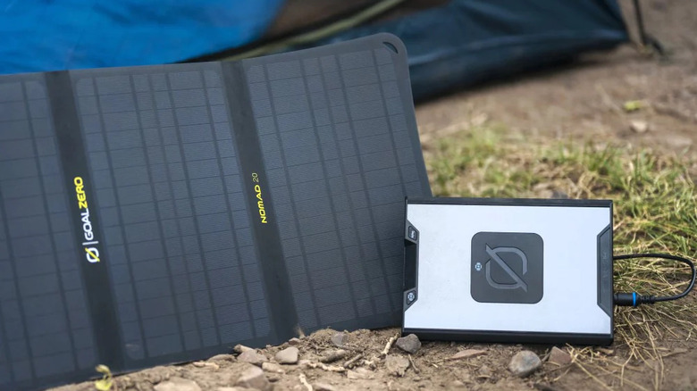 Goal Zero Sherpa 100 with solar panel at campsite