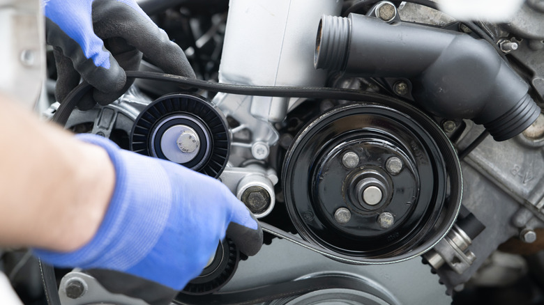 mechanic working on a timing belt