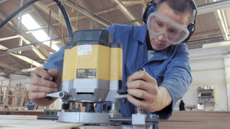 Person using large wood router