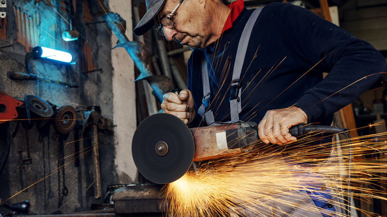 Person using large angle grinder