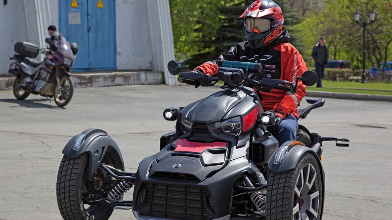 Black tricycle BRP Can-Am RYKER on a test drive