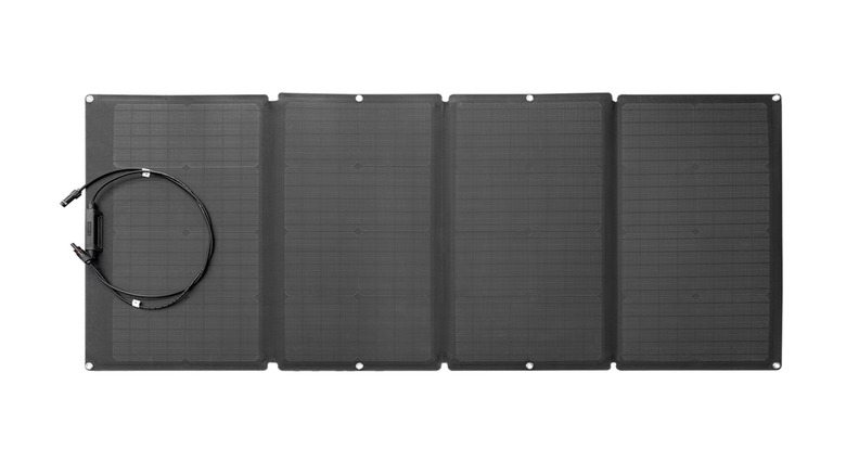 Four-section solar panel with charging cable on a white background