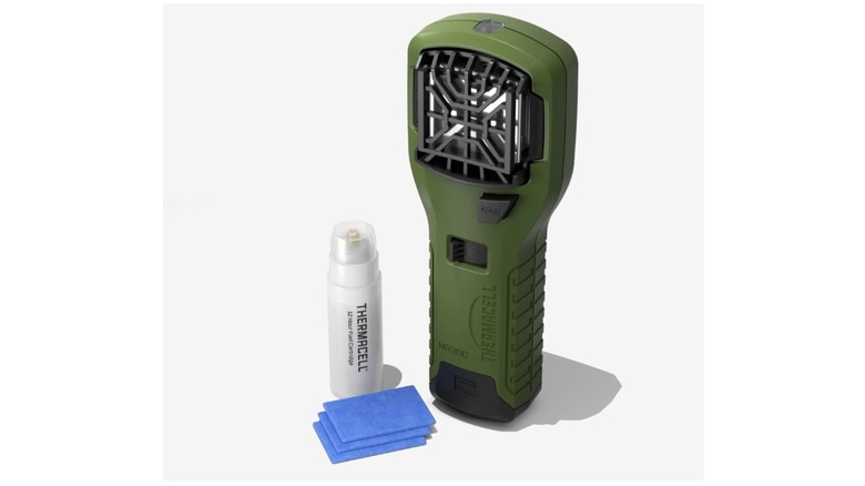 Army green handheld device against a white background