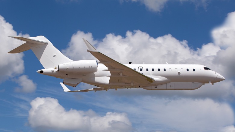 U.S. Army Bombardier Global 6500 flying in a cloudy sky