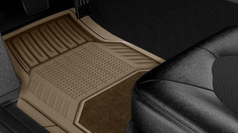 Michelin tan floor mats installed in the driver's footwell