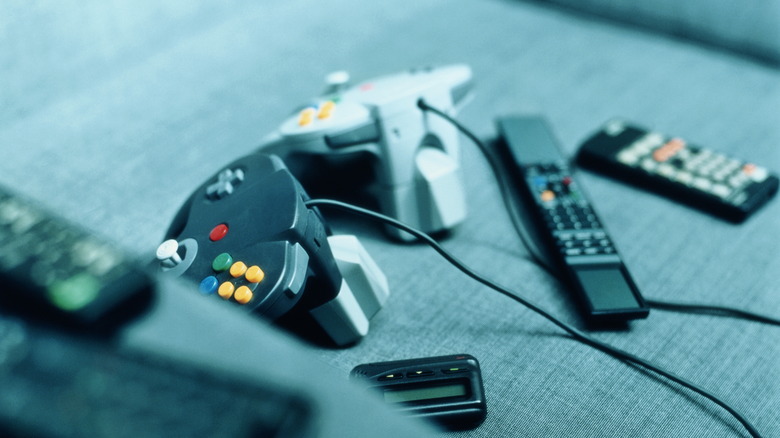 Nintendo 64 controllers on couch