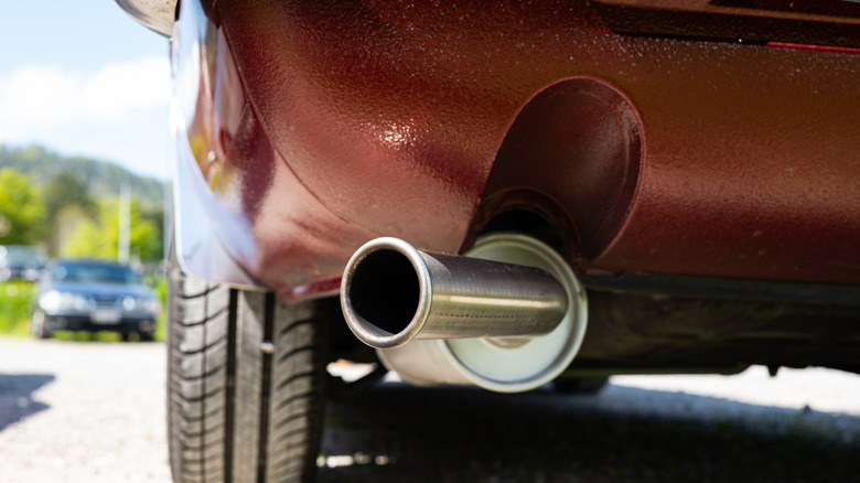 Close-up of aftermarket muffler fitted to economy car