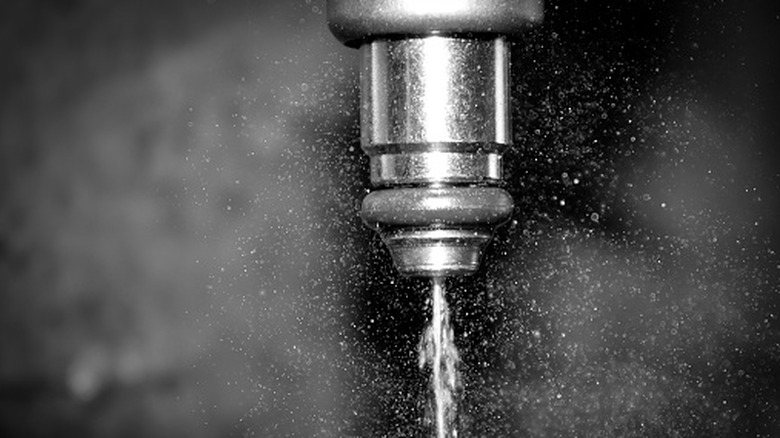 Close-up of fuel injector at work