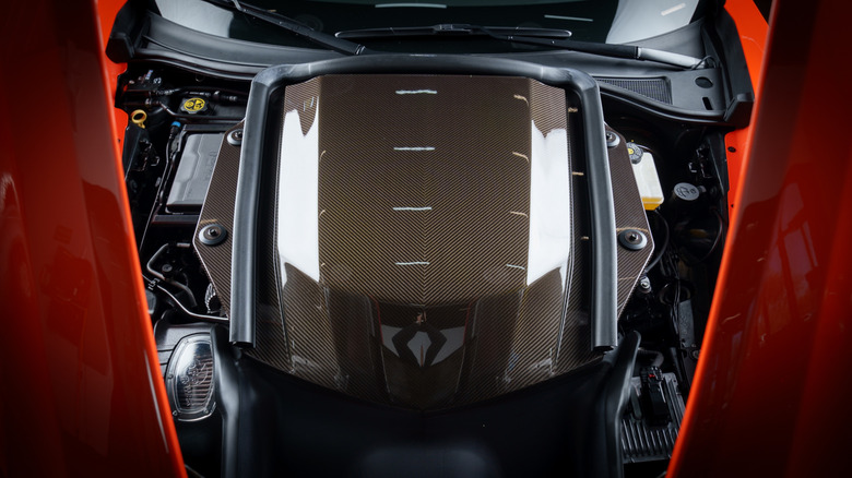 A close-up of an orange Hennessey 2019 Corvette ZR1 LT5 engine cover.