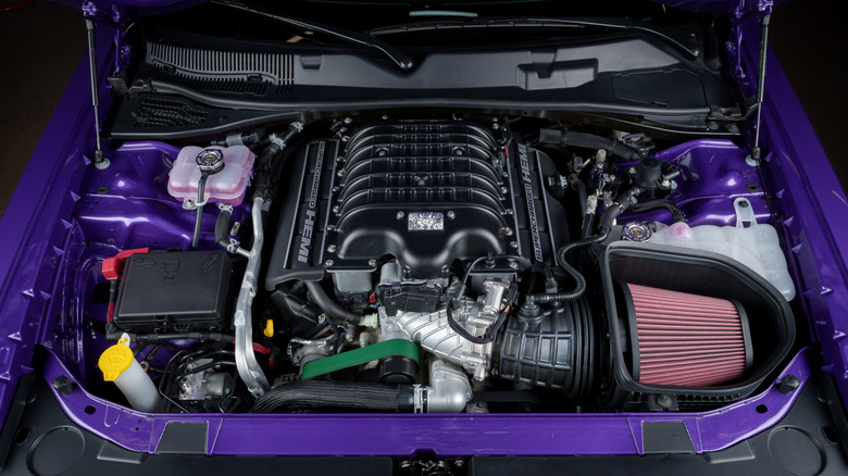 A purple Dodge Demon 170 showcasing its supercharger and HEMI engine.