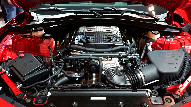 A close-up of a red Chevrolet Camaro LT4 V8 engine.