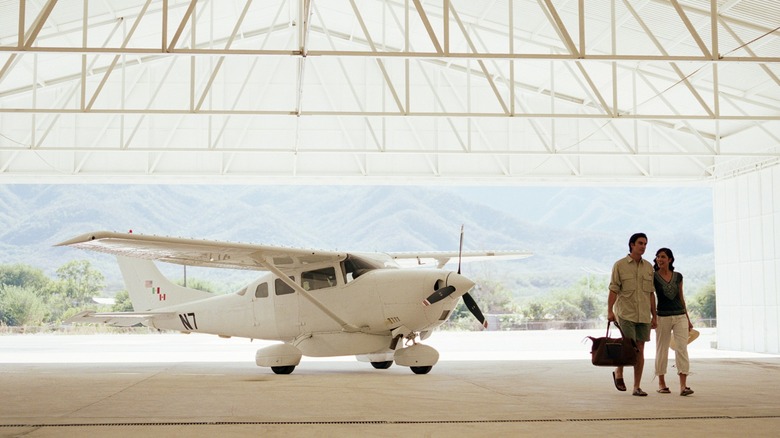 White airplane in hangar