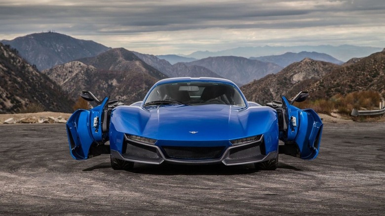 Rezvani Beast Alpha X in blue parked in mountains