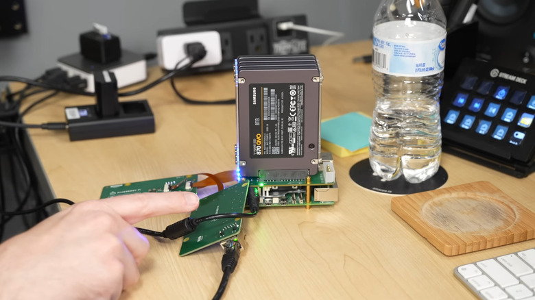 Jeff Geerling pointing at Raspberry Pi NAS