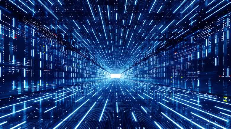 Futuristic image of blue lines of light zooming towards the camera, in the shape of a tunnel