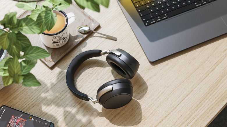 The Sennheiser HDB 630 headphones next to a MacBook.