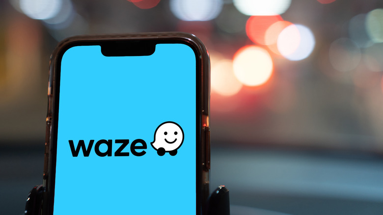 waze app on a smartphone inside a car