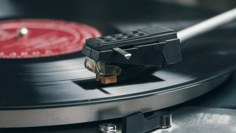 A close-up of a stylus on a record player.