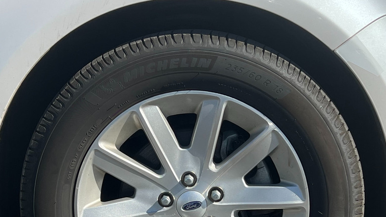 Close-up of a Michelin Defender 2 tire on a Ford vehicle.