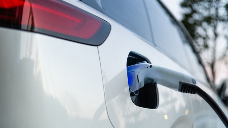 A charger plugged into a vehicle.