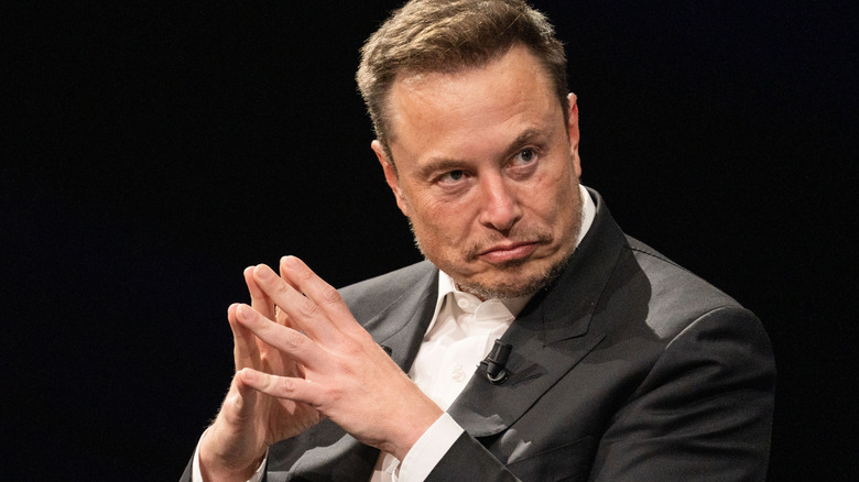 Elon Musk posing menacingly