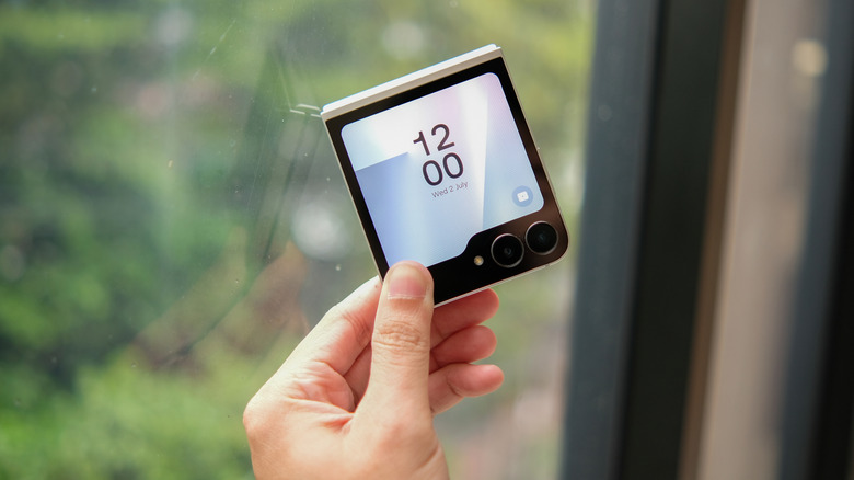 A person holding a Samsung Galaxy Z Flip6