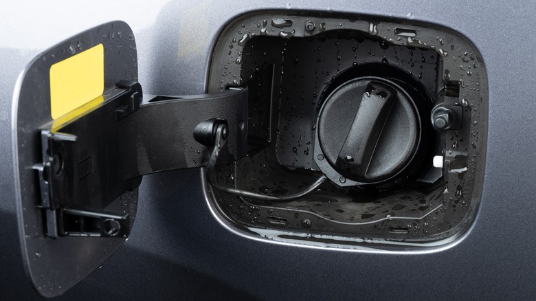 open gas cap with water droplets