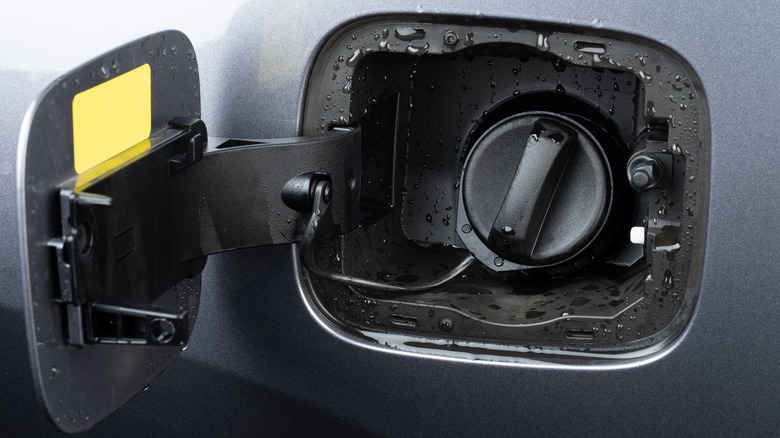 open gas cap with water droplets 