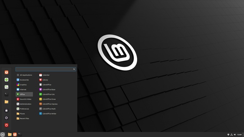 Linux Mint with the start menu being opened on the lower left, and showing the few programs running.